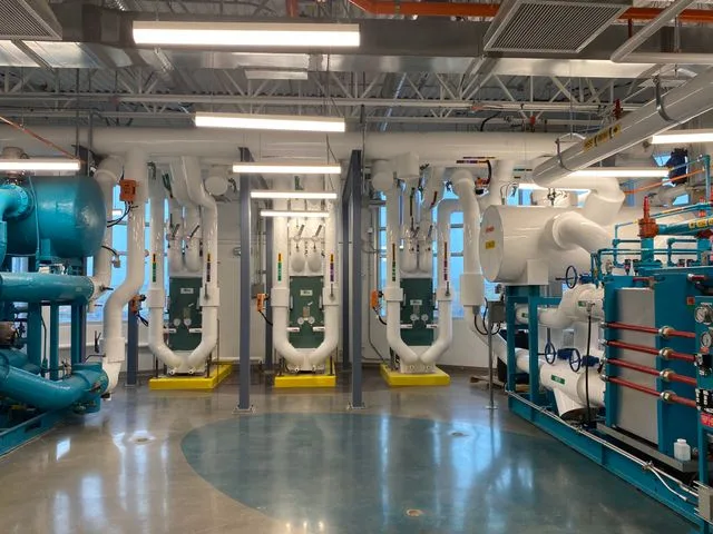 Commercial refrigeration equipment using specialty refrigerants for industrial cooling applications